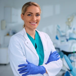 Experienced cosmetic dentist in Yorba Linda standing confidently in a modern dental clinic